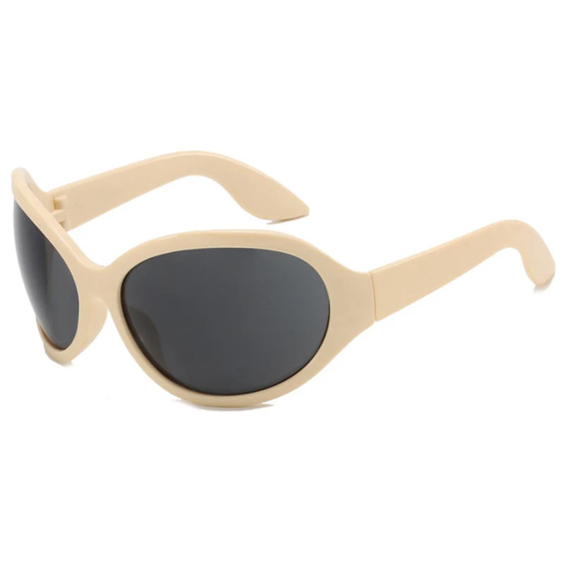 Beige oversized sunglasses with black lenses on a white background